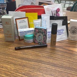 Small red cosmetic bag with samples all new